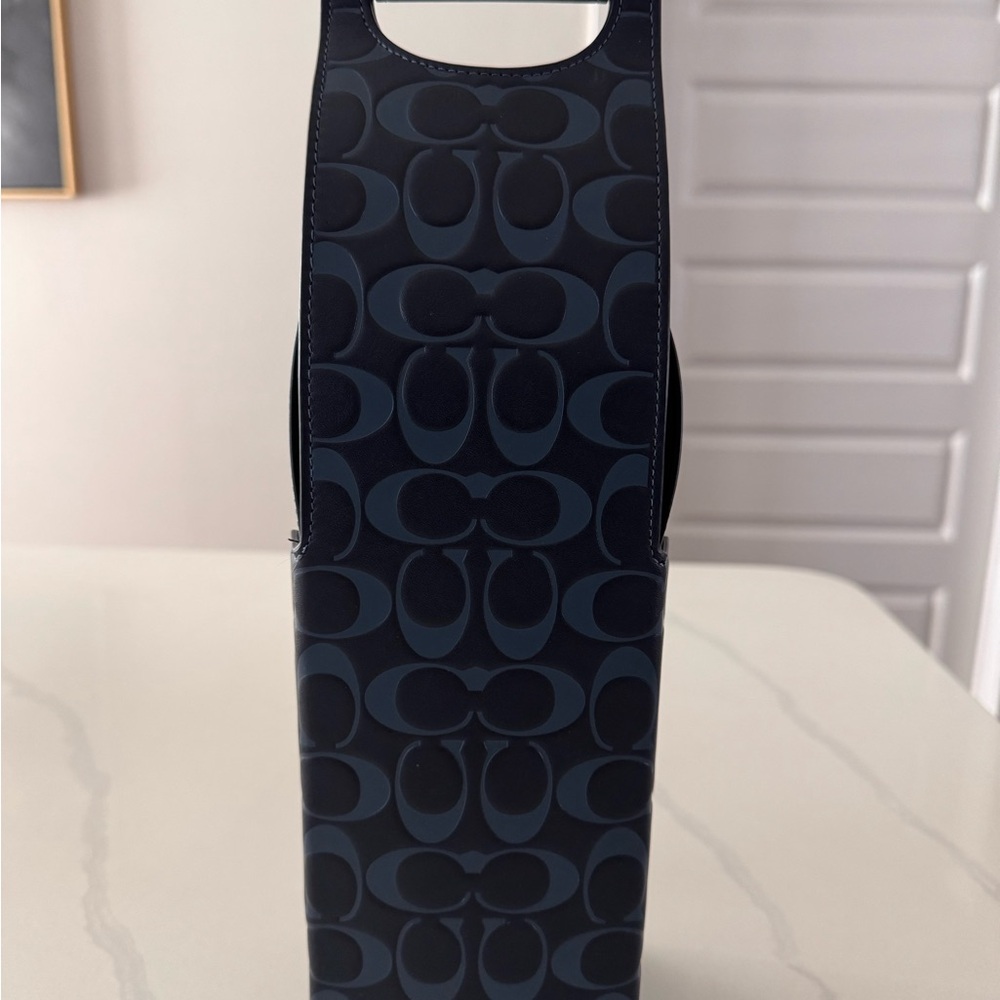 Leather Navy Blue Patterned Coach wine carrier.